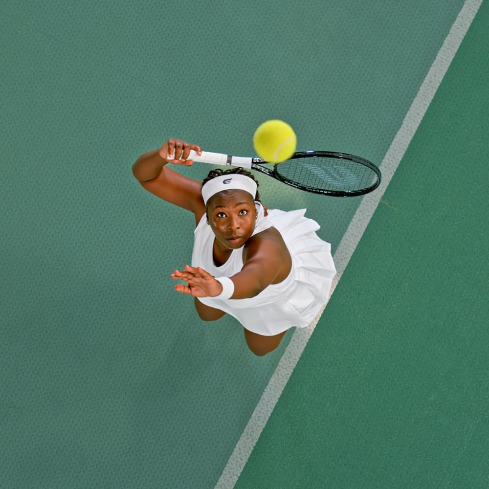 Female tennis player hitting a ball